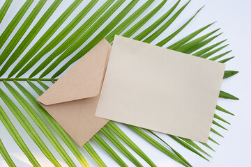 Brown paper and envelopes on green leaves