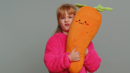 Cheerful funny young preteen child girl kid making showing faces at camera, fooling around, joking,...
