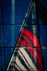 Red and white house with reflections in the windows