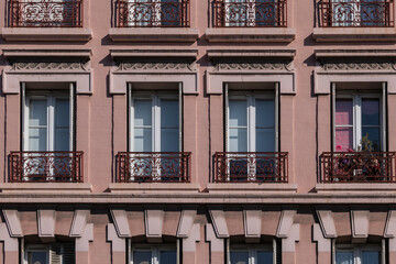 Obraz premium Traditional old French house: balconies and windows. Paris, France.
