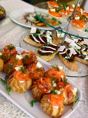 table setting with appetizers, plates, glasses