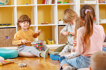 Preschool children with instruments in a music class