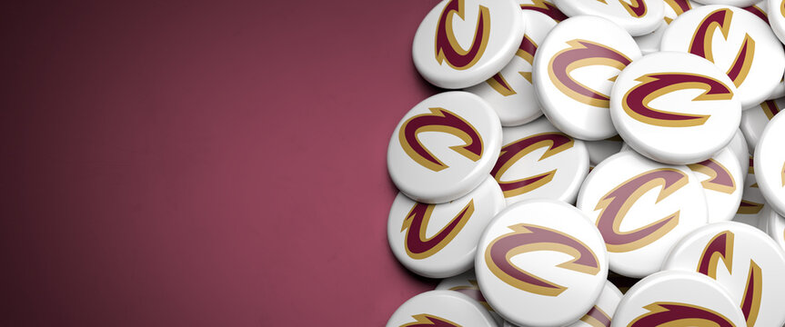 Logos of the American NBA Basketball Team Cleveland Cavaliers on a heap on a table.
