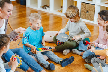 Preschool children with instruments in a music class