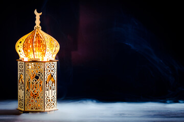 Wooden Ramadan lantern glowing at night. Banner template for Ramadan Kareem, Muslim Holy Month.