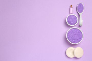 Flat lay composition with aromatic sea salt on purple background. Space for text