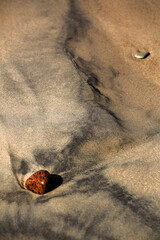 Fototapeta na wymiar Creative beach sand with small stones