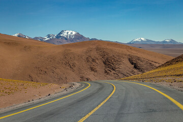 Road in Moon Valley dramatic landscape at Sunset, Atacama Desert, Chile