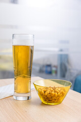 Beer and peanuts served in a cafe bar