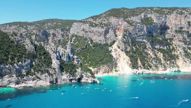 Baunei Coast and Cala Goloritze Beach - Tourist Boat Excursions during Vacation in Sardinia, Italy - Aerial 4k