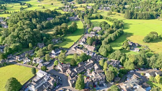 Cinematic aerial view of the Lakeland town of Grasmere. Showing the small lakeland town. English Lake District National Park, Cumbria