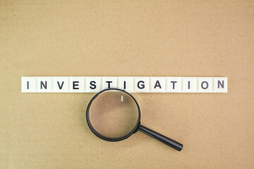 letters of the alphabet with the word investigation. the concept of a spy or the investigation of a...
