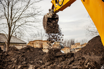 Cropped picture of an excavator removing earth on site with bucket. © Dusan Petkovic