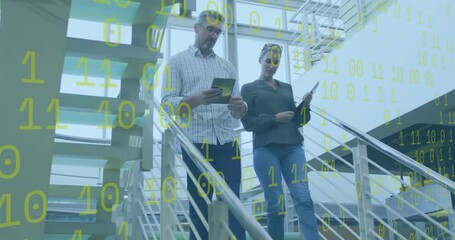 Animation of binary coding and data processing over diverse business people in office - Powered by Adobe