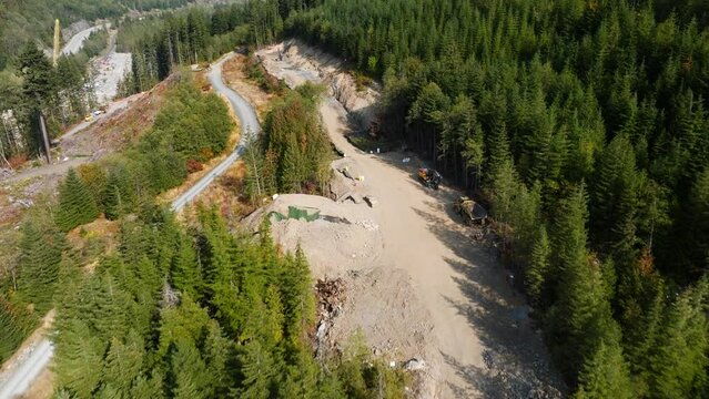 Construction of the TMX oil and gas pipeline in British Columbia Canada. Building an oil pipeline near a river.