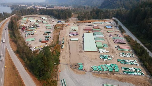Oil and gas pipeline building. Materials to construct the TMX oil pipeline in BC. The fossil fuel industry's pipe of oil from the Alberta Oil Sands to export crude petroleum products.