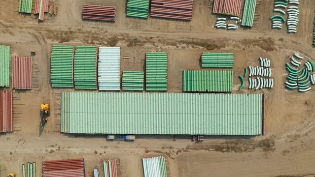 Oil and gas pipeline building. Materials to construct the TMX oil pipeline in BC. The fossil fuel industry's pipe of oil from the Alberta Oil Sands to export crude petroleum products.