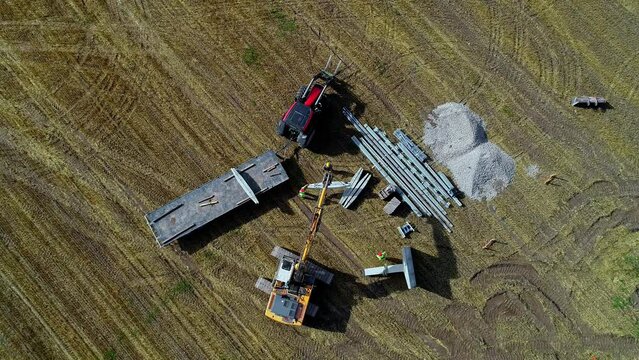 Telescopic handler unloading materials for building on the the site.