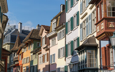 Obraz premium A row of multicolored houses along Augustinergasse in Zurich