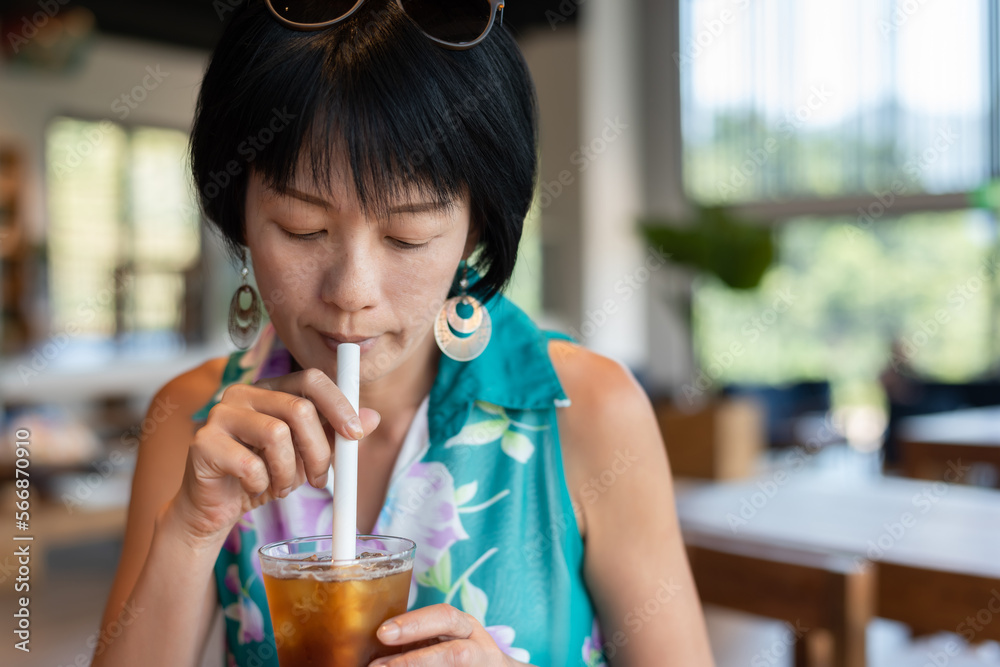 Poster woman holding a cup of ice tea