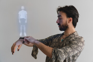 Latin gay man chooses his outfit through a hologram emitted by his smart watch.