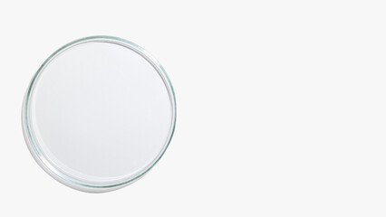 An empty petri dish on a light background.