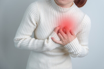 woman hand holding chest ache. Heart disease, angina disease and symptom heart attack disease...