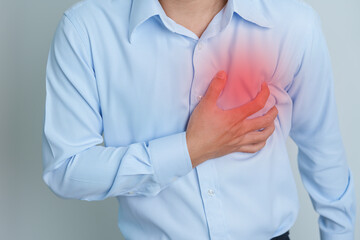 man hand holding chest ache. Heart disease, angina disease and symptom heart attack disease...