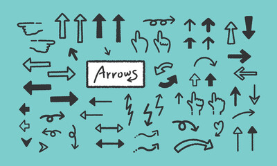 Set of hand-drawn arrows and marks for a comic book design. Vector illustration isolated on a green background.