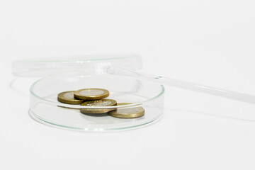 Financial concept. Finance analysis. Market analysis. Money bills and coins. Laboratory equipment on a light background.