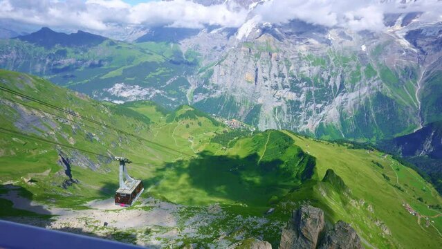 cable car gondola, Mannlichen in Swiss Alps, trail to Kleine Scheidegg, beautiful hike in Jungfrau region, Bernese Oberland in Switzerland.