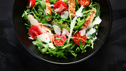 Chicken breast and fresh vegetable salad.