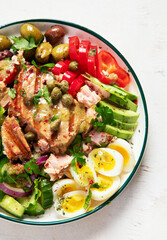 Tuna salad with lettuce, eggs and tomatoes.