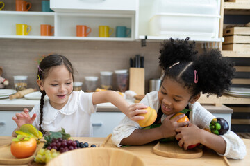 The child is playing fruits. children lying on toy kitchen cooking. Kids Educational, creative...