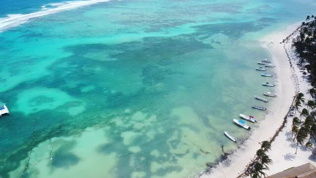 Aerial view of the clear water beach in Akumal in the mayan riviera with yachts and catamarans in the Mayan Riviera, Mexico. 