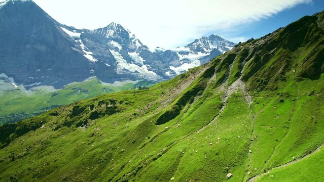 Aerial drone view of Mountain Eiger, Jungfrau famous landmark in Switzerland. Swiss Alps in summer.