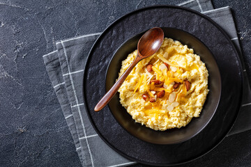 corn grits with butter, vegan cheese, and almonds