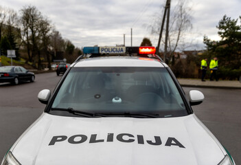 Polaction, auto, automobile, capital, car, citizen, city, constable, cop, country, crime, design, drive, driver, editorial, emergency, enforcement, europice car, signal beacons, police sign. Lithuania