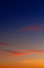 Sunset sky with pink and gray clouds
