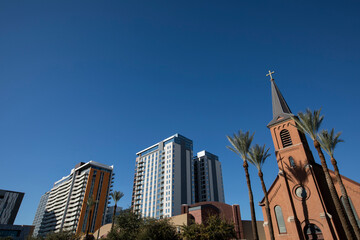 Afternoon historic church framed view of downtown Tempe, Arizona, USA.