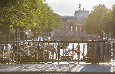 Sunlight over bicycles on the bridge, Amsterdam, Netherlands