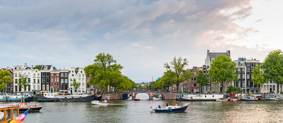 Fototapeta premium Panorama amsterdam Canals with bridge and dutch houses, Netherlands