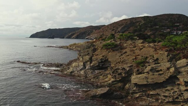 Drone shot flying along coastline in Cap de Creus peninsula in Spain
