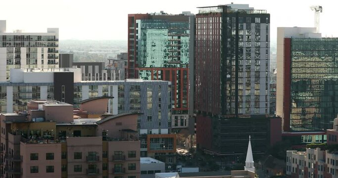 Afternoon sun shines on the urban skyline of downtown Tempe, Arizona, USA.