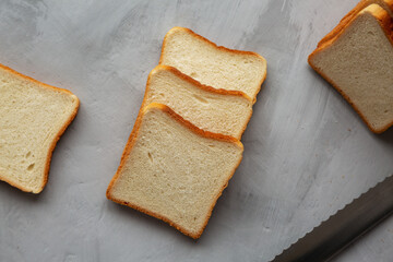 Sliced Whole Wheat White Bread on a gray background, top view. Flat lay, overhead, from above.