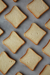 Sliced Whole Wheat White Bread on a gray background, top view. Flat lay, overhead, from above.