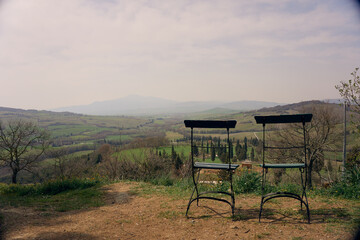 chairs in the garden with view over tuscany
