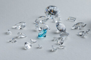 Coloured diamonds of different sizes at the workplace of a diamond expert sorting. High quality photo