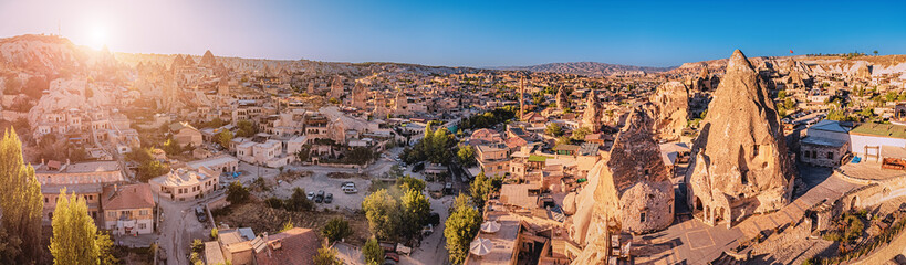 Aerial view of Hotels and houses carved into the rocks of soft volcanic tuff in Cappadocia - one of the wonders of the world in Turkey.