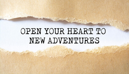 Fototapeta na wymiar 'Open your heart to new adventures' written under torn paper.